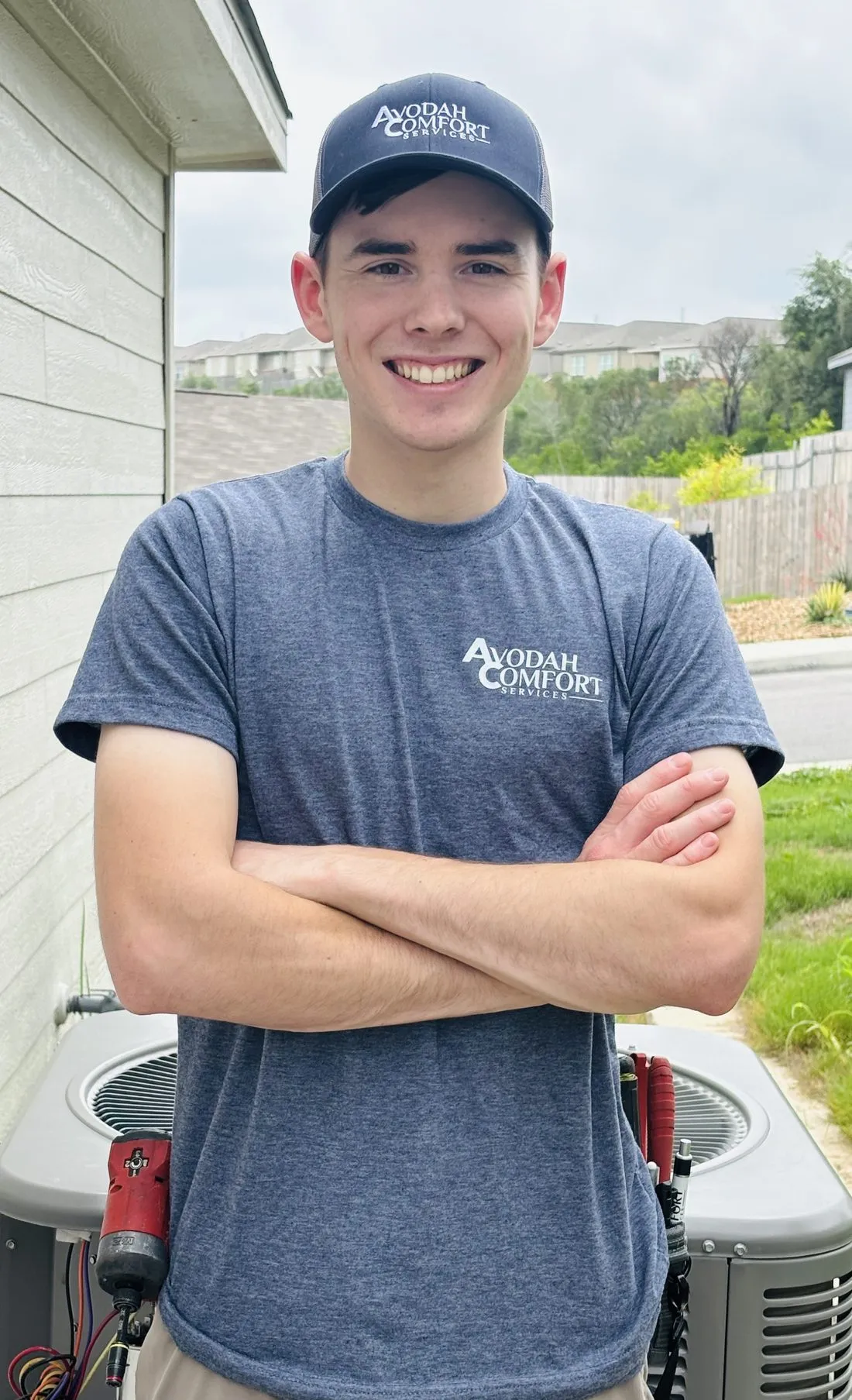 Micah of Avodah Comfort Services servicing an HVAC system